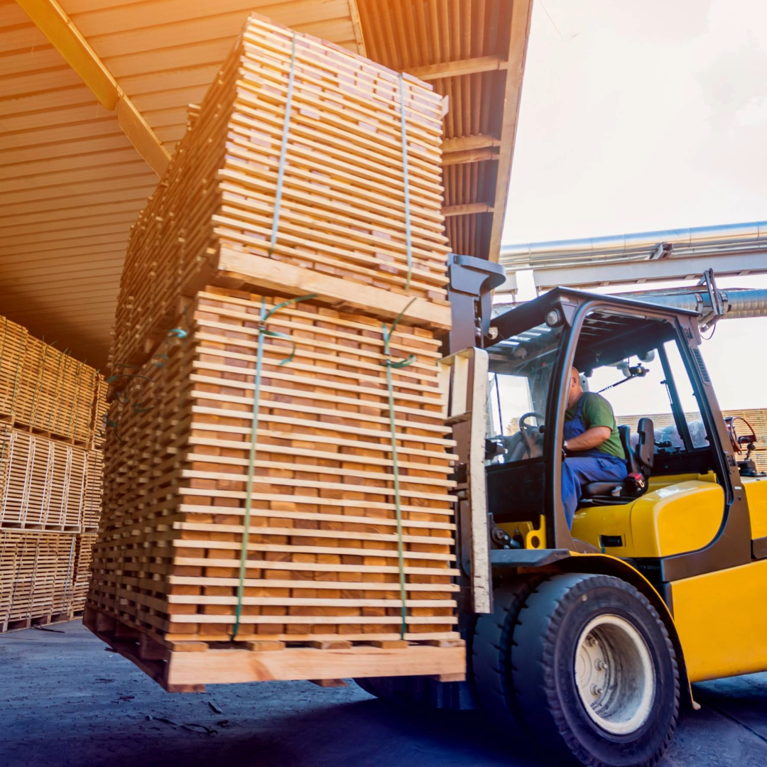 a man transporting a wooden crates 